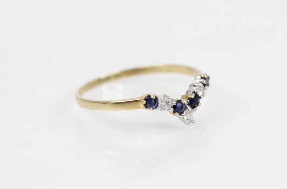 A diamond and sapphire 9ct gold chevron ring, comprising three round mixed cut diamonds and four - Image 2 of 3