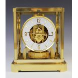 A Jaeger-Le Coutre Atmos clock, serial number 310731, the white enamel bezel applied with gilt metal