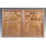 A pair of stained hardwood carved panels, each carved in relief with a basket of fruit within