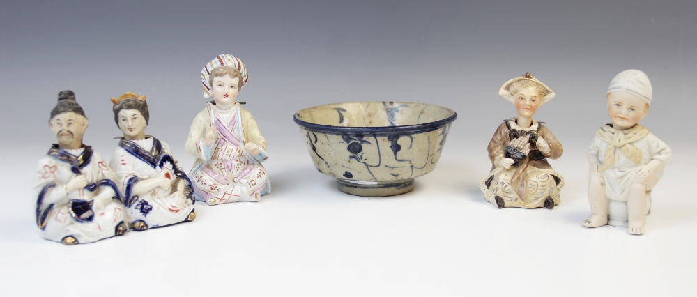 A Chinese 'nodding' figural group, modelled as a man and woman seated side by side, 9.5cm high, with