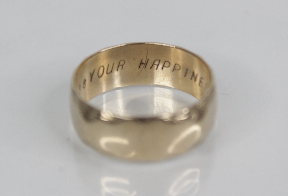 A 9ct gold wedding band, with scalloped star-cut border decoration, engraved 'YOUR HAPPINESS' to - Image 2 of 3