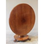 A mid 19th century mahogany centre table, the circular moulded tilt top raised upon an octagonal