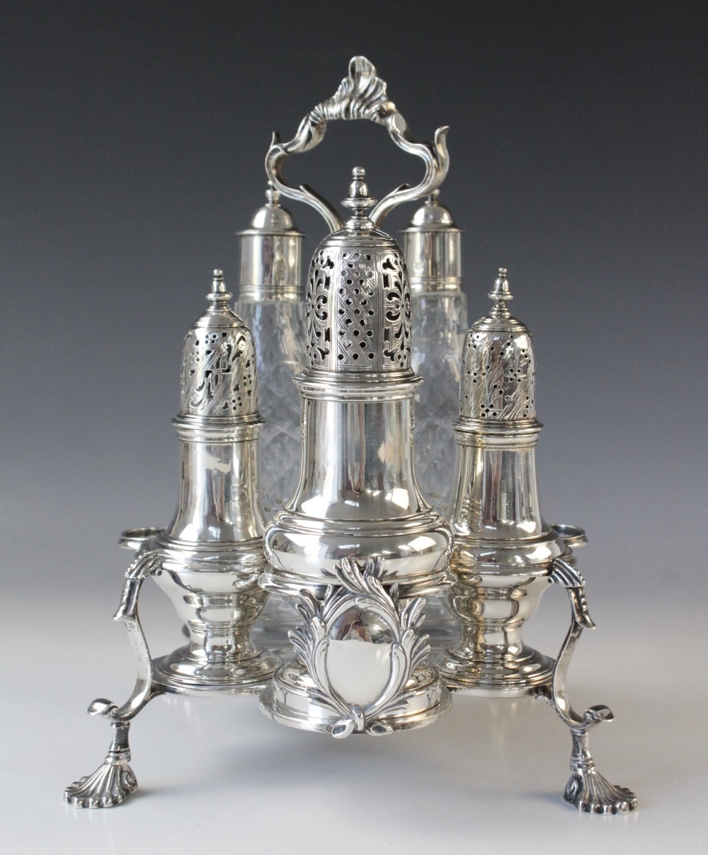 A George III silver cruet stand by Thomas & Jabez Daniell, London 1772, cinquefoil form with central