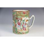 A Chinese Canton famille rose tankard, 19th century, of cylindrical form with moulded handled,