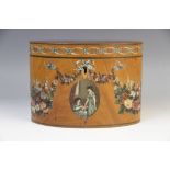 An Edwardian Sheraton revival satinwood tea caddy, of oval form, painted with floral swags and