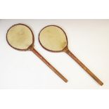 A pair of badminton rackets by Buchanan Ltd, early 20th century, with bent wood frames and vellum