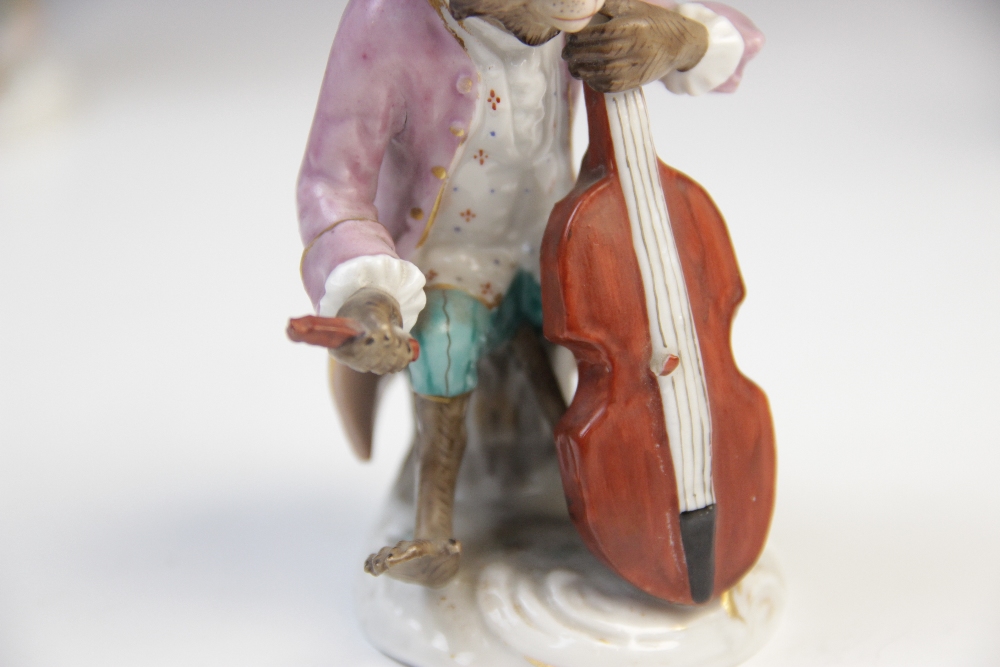 An eight piece German porcelain monkey band, 19th century, comprising: a conductor, a violinist, a - Image 6 of 8