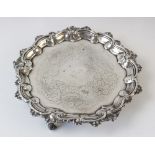 A silver salver circa 1830, possibly by Edward Farrell, of shaped circular form with cast pie