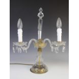 An early 20th century French crystal three branch table candelabra, the three 'S' shaped branches