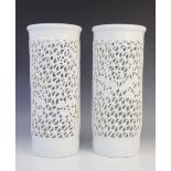 A pair of Chinese blanc de chine reticulated sleeve vases, 20th century, each of cylindrical form