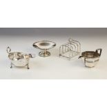 A George VI silver four-division toast rack by HF Withers, Birmingham 1936, 7.8cm long, together