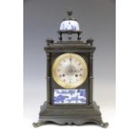 A late 19th century Aesthetic Movement clock signed J W Benson, the bronzed architectural case