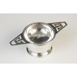 A George IV silver tea strainer and stand by G W Lewis & Co, Birmingham 1941, the circular bowl with
