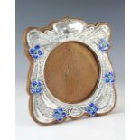 An Art Nouveau silver and enamel photograph frame, Synyer & Beddoes, Birmingham 1904, of shaped