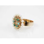 A 1960's 14ct gold turquoise and pearl dress ring, the central circular panel set with six turquoise