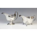 A Victorian silver sauce boat by Thomas Hayes, Birmingham 1892, of helmet form on pedestal foot with