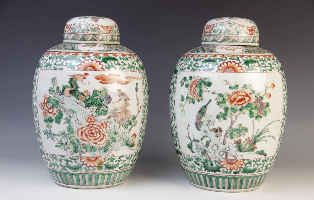 A pair of Chinese famille verte ginger jars and covers, 20th century, each with a panel depicting