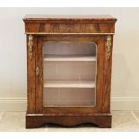 A Victorian figured walnut pier cabinet, the rectangular moulded top above a plain frieze and a gilt