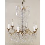 A French crystal chandelier, early 20th century, the baluster moulded central column extending to