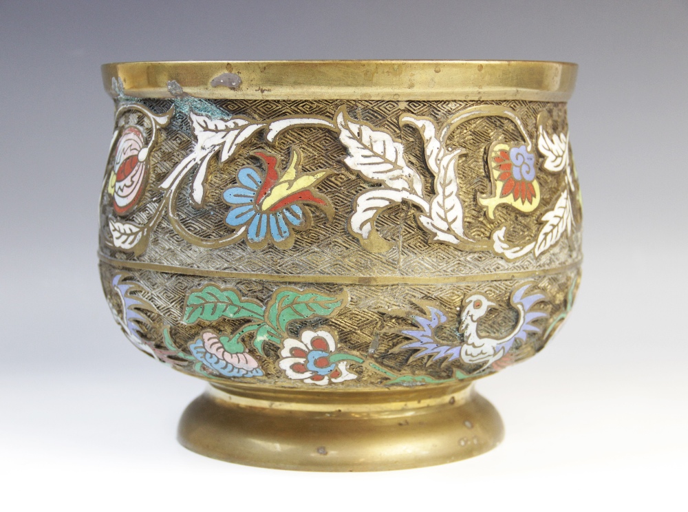 A Chinese bronze and enamel footed bowl, decorated with relief cast enamelled floral and foliate