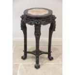 A Chinese hardwood and rouge marble urn stand, late 19th century, the scalloped circular top inset