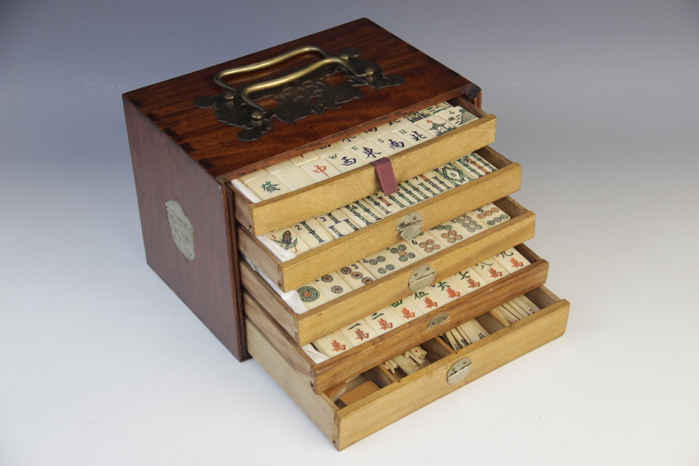 A Chinese Mahjong gaming compendium, enclosing five separate drawers each containing bone gaming