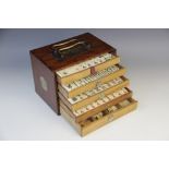 A Chinese Mahjong gaming compendium, enclosing five separate drawers each containing bone gaming