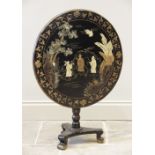 A Victorian Japanned hardwood pedestal table, the circular tilt top with a gilt foliate trailing