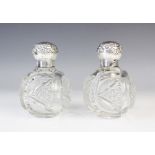 A pair of late Victorian silver mounted cut glass scent bottles by John Grinsell & Sons,