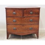 A mid 19th century mahogany bow front chest of drawers, formed from two short, over two long cock