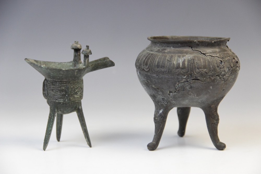 A Chinese bronze tripod censer of small proportions, early 19th century, 11cm high, with a Chinese