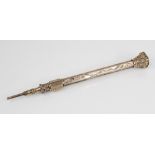 A Victorian yellow metal propelling pencil, of faceted form with scrolling floral decoration and