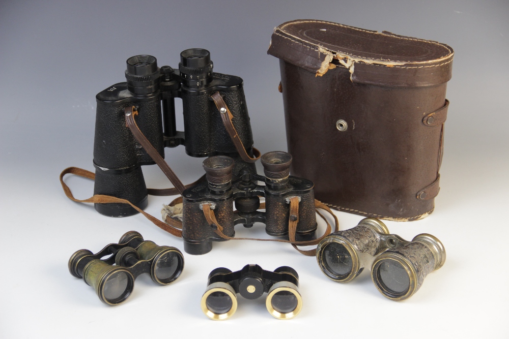 Three pairs of opera glasses including a mother of pearl banded example, a pair of military issue