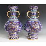 A pair of Chinese twin handled cloisonné vases of large proportions, 20th century, each of
