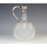 A Victorian cut glass silver mounted decanter by Horace Woodward & Co, London 1887, of compressed