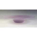 A large studio glass centre bowl, 20th century, the mottled lilac bowl of circular form with