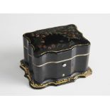 A papier mache miniature casket, 19th century, the serpentine form casket decorated with holly and