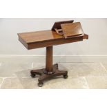 A William IV rosewood reading/music table, the rectangular top with two opposing adjustable book