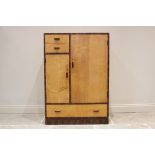 An Art Deco style satin birch and cross banded gentleman's wardrobe, mid 20th century, of