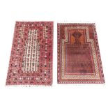 An Afghan Taimani prayer rug, woven in red, black and cream with a central spade shaped medallion