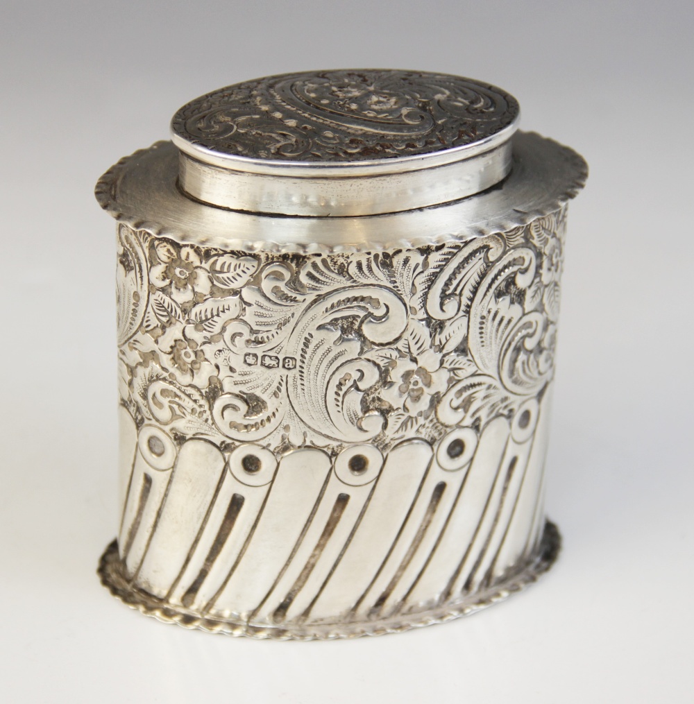 A George V silver tea caddy, William Hutton & Sons, Sheffield 1918, of oval form with waved borders,