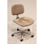 A mid century swivel office chair, with an adjustable padded back over the padded seat, raised