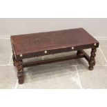 A leather topped South American table on barley twist supports, 20th century, the rectangular top
