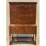 An early 18th century and later walnut chest on stand, the moulded cornice above an arrangement of