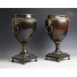 A pair of 19th century Adam style bronzed urns, of typical tapering form, with applied gilt metal