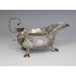 A George II silver sauce boat, Isaac Cookson, Newcastle 1752, of typical form with scalloped border,