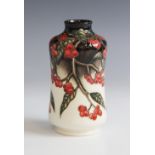 A Moorcroft vase in a berry and foliate design by Anji Davenport (2009), of waisted cylinder form,