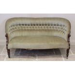 A Victorian rosewood sofa, upholstered in green velour, the button back extending to carved scrolled