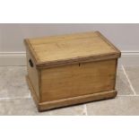 A 19th century pine chest, the rectangular hinged cover opening to a fitted candle box, applied with