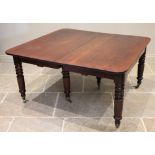 A mid 19th century mahogany extending dining table, the rectangular top with rounded corners